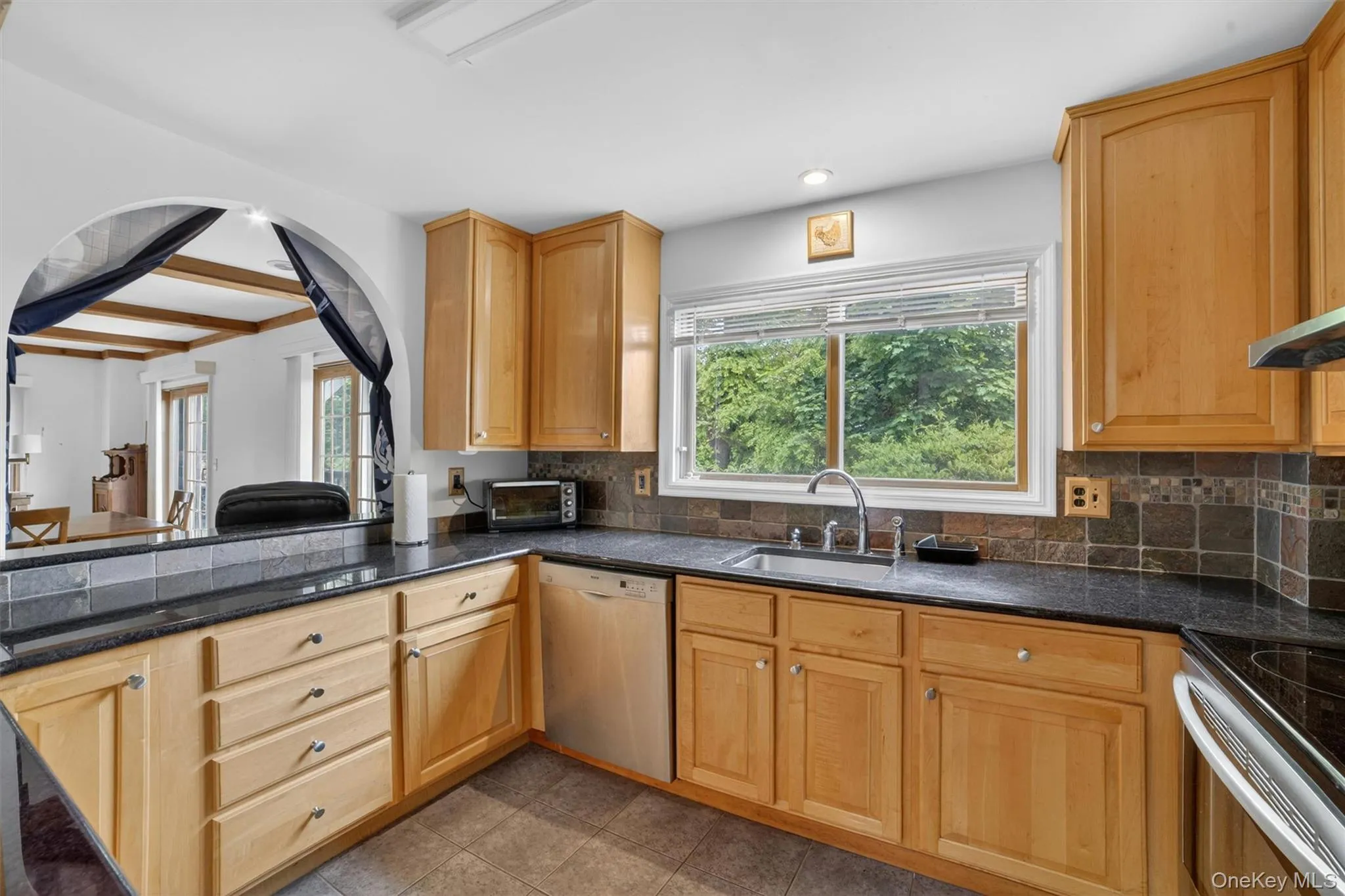 Warm and inviting kitchen space designed to capture the beauty of the surrounding landscape and river views. Warm and inviting kitchen space designed to capture the beauty of the surrounding landscape and river views.