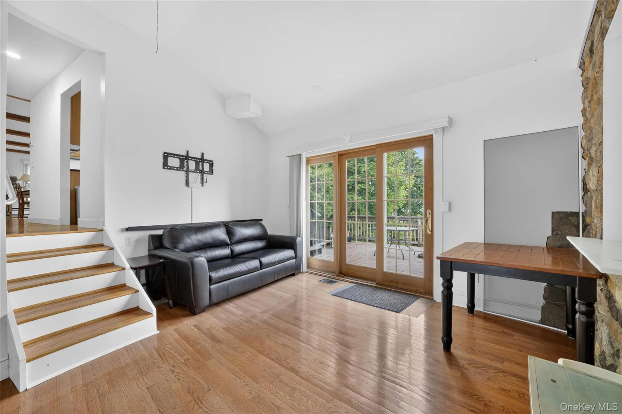Family room designed for indoor-outdoor living with direct access to the expansive two-tiered deck and breathtaking river views. Family room designed for indoor-outdoor living with direct access to the expansive two-tiered deck and breathtaking river views.