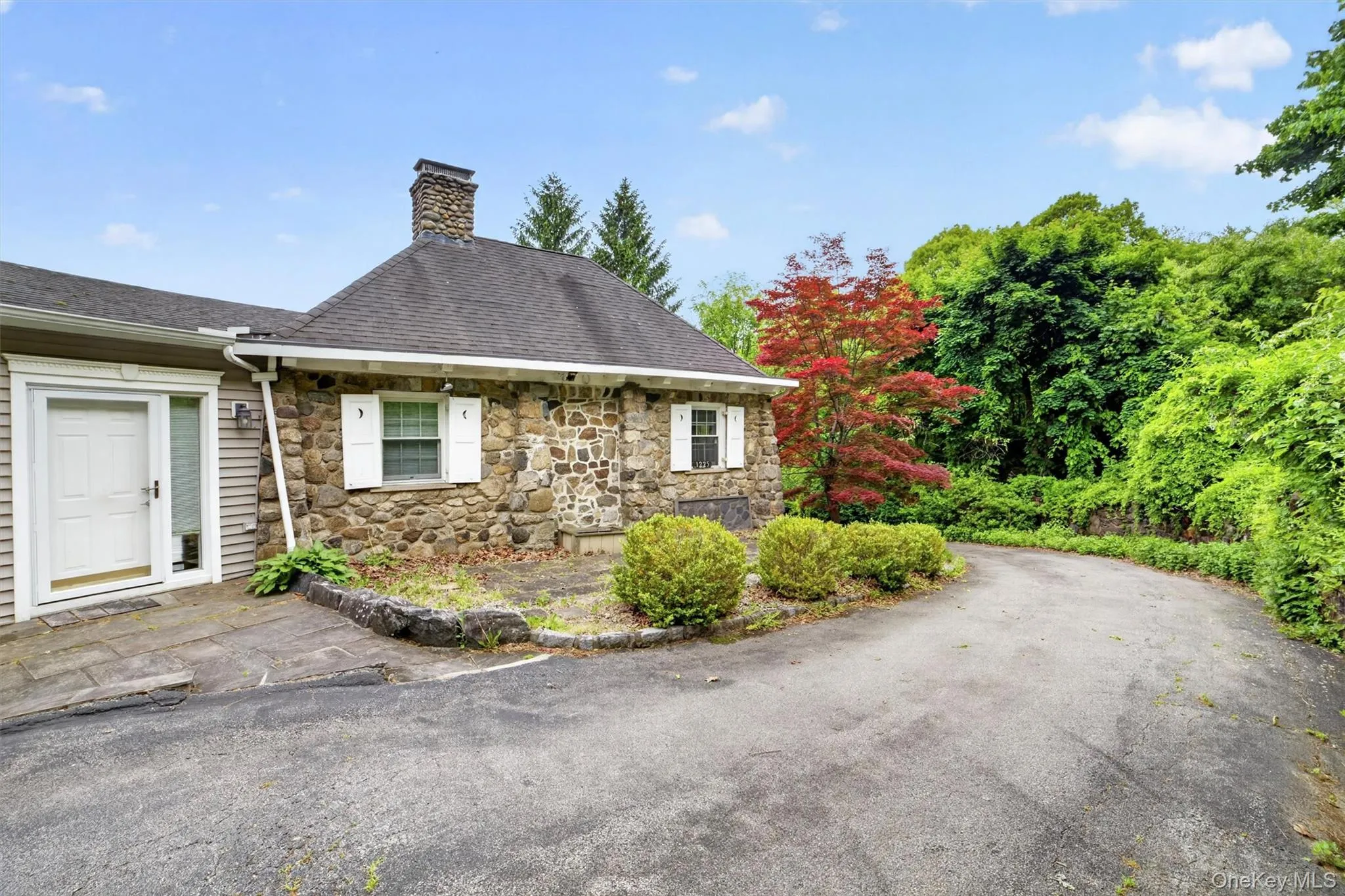 Charming view of the original gatehouse showcasing the home’s historic roots, distinctive architecture, and beautifully preserved stone exterior. Charming view of the original gatehouse showcasing the home’s historic roots, distinctive architecture, and beautifully preserved stone exterior.