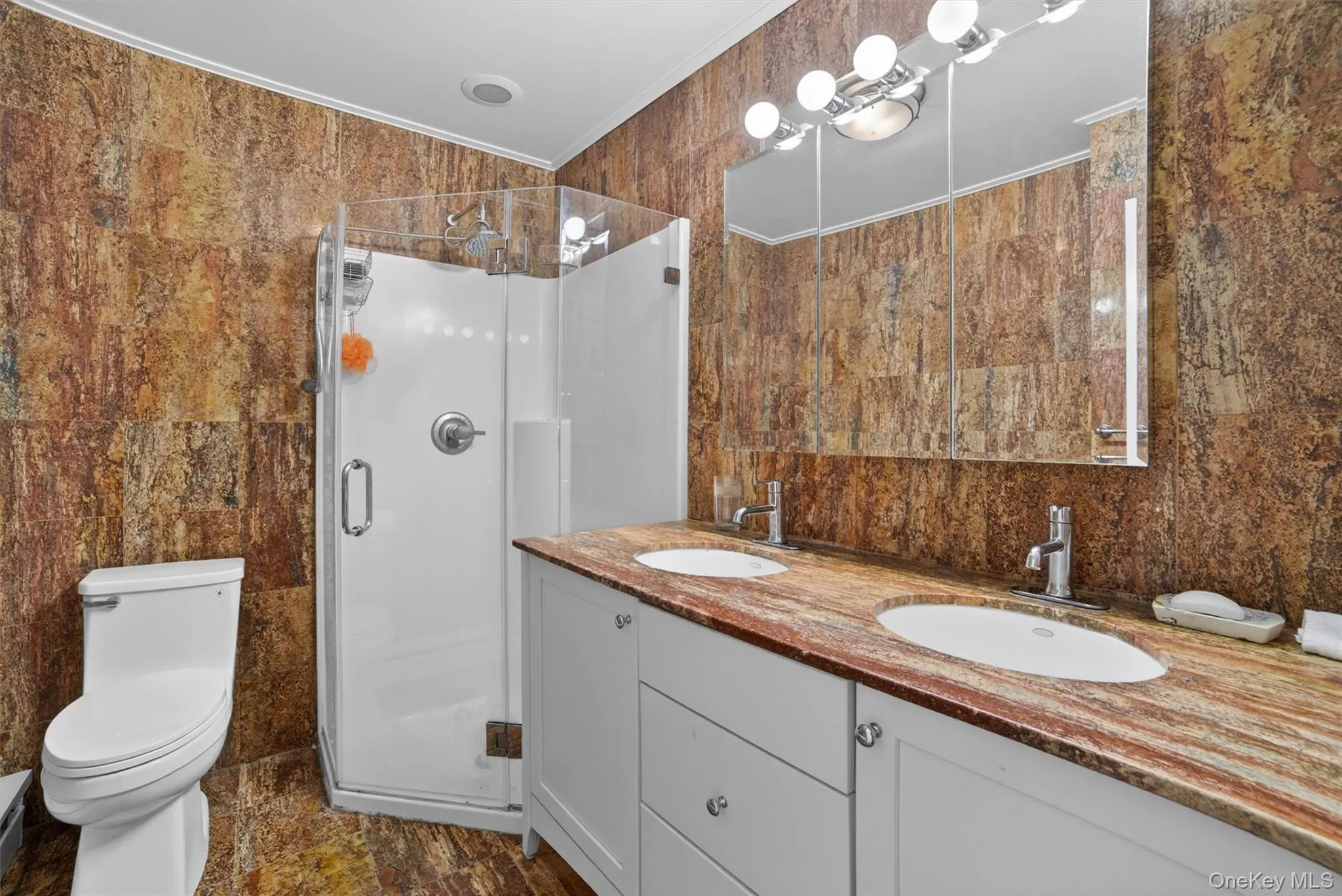 Private primary bathroom featuring a full layout with a clean, comfortable design and a relaxing feel. Private primary bathroom featuring a full layout with a clean, comfortable design and a relaxing feel.