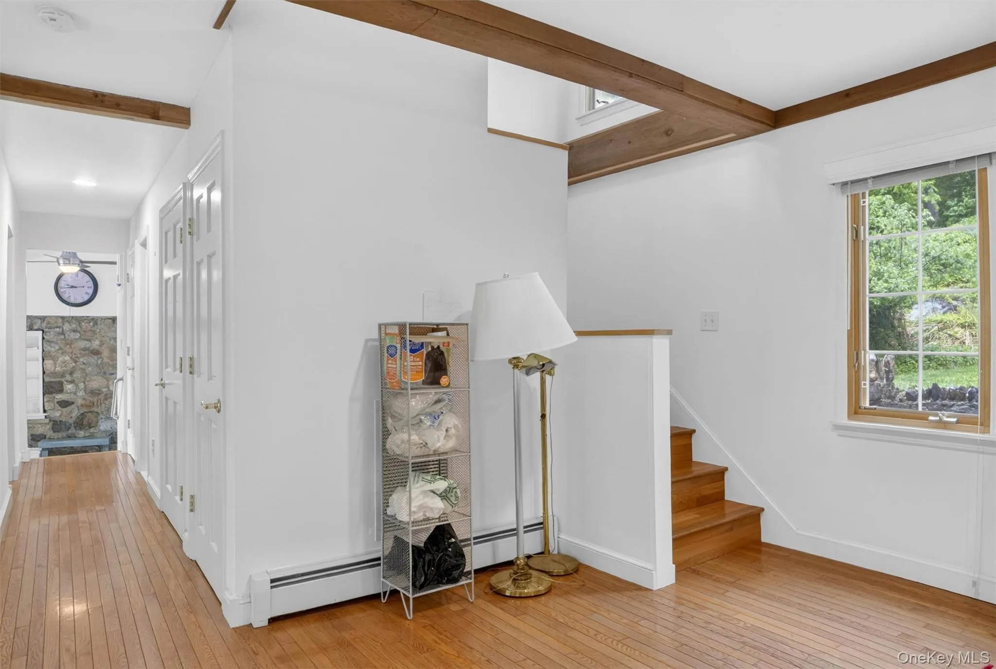 A charming staircase leads to the upper-level bedrooms, adding warmth and character to the home’s unique layout. A charming staircase leads to the upper-level bedrooms, adding warmth and character to the home’s unique layout.