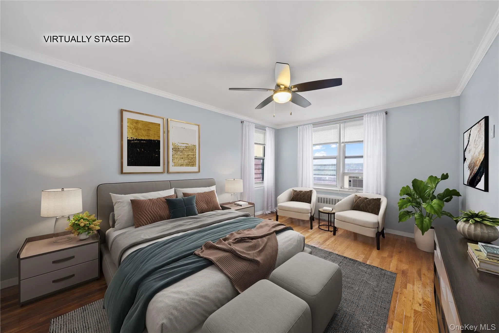 Bright room featuring wood-finish flooring, two windows with blinds, and crown molding Bright room featuring wood-finish flooring, two windows with blinds, and crown molding