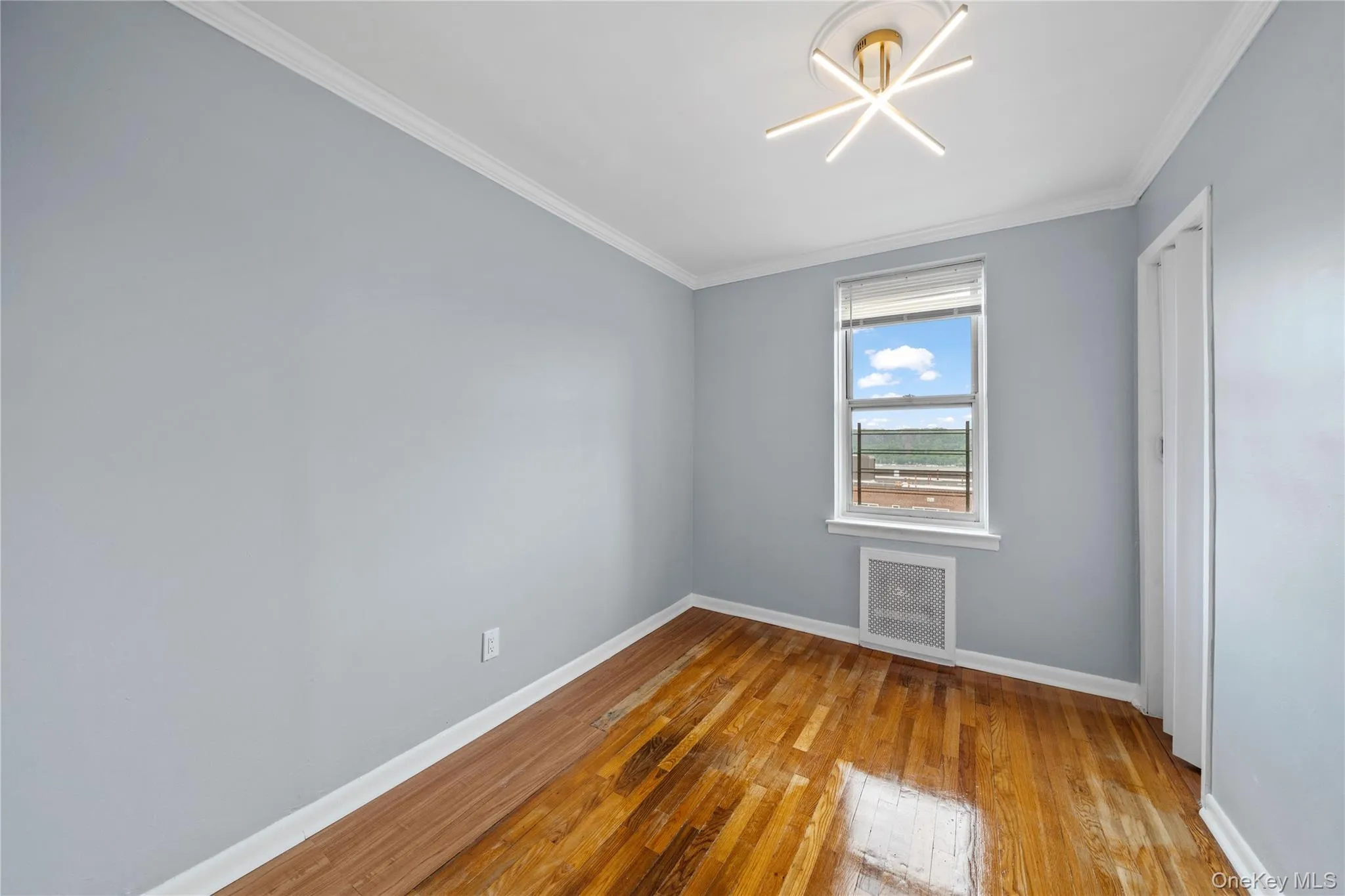Hardwood flooring complements light blue walls and crisp white trim Hardwood flooring complements light blue walls and crisp white trim