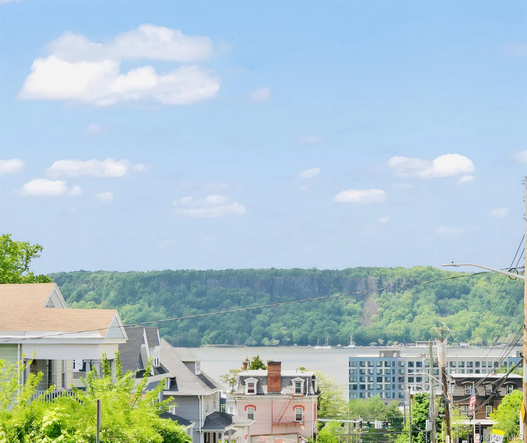 Sweeping views of Hudson River with a forested hillside backdrop Sweeping views of Hudson River with a forested hillside backdrop