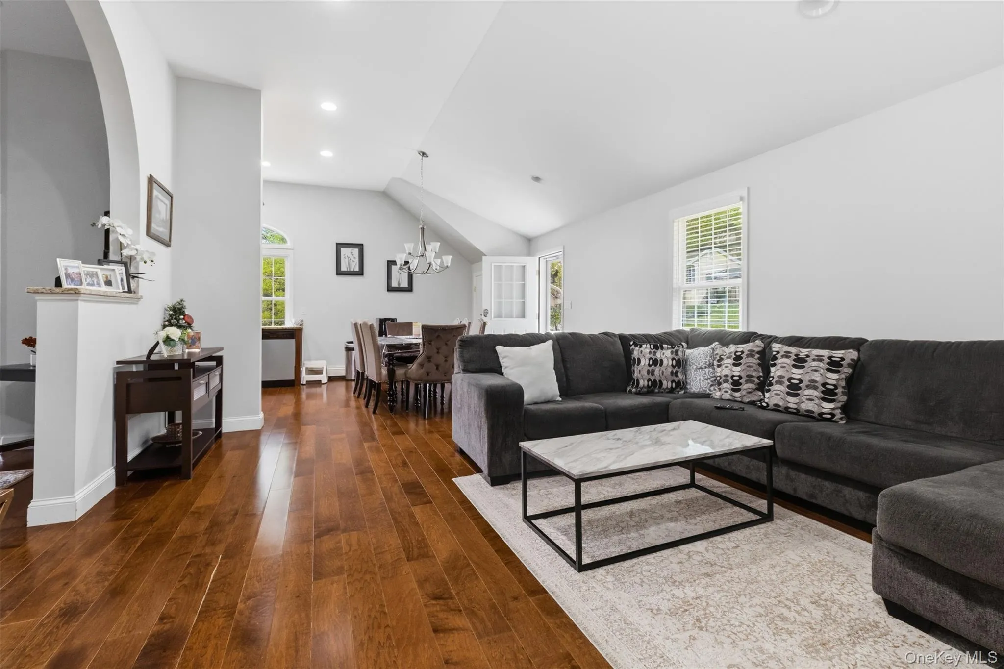 Accessory Unit -Open-concept living area with wood-finish flooring, vaulted ceilings, and recessed lighting Accessory Unit -Open-concept living area with wood-finish flooring, vaulted ceilings, and recessed lighting
