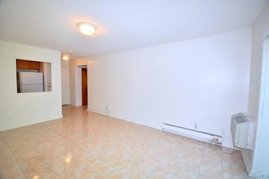 Living room has sliding glass doors to a private balcony. Living room has sliding glass doors to a private balcony.