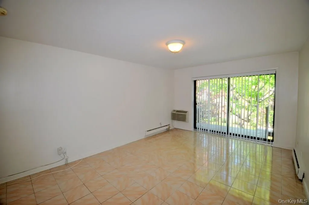 Living room has sliding glass doors to a private balcony. Living room has sliding glass doors to a private balcony.