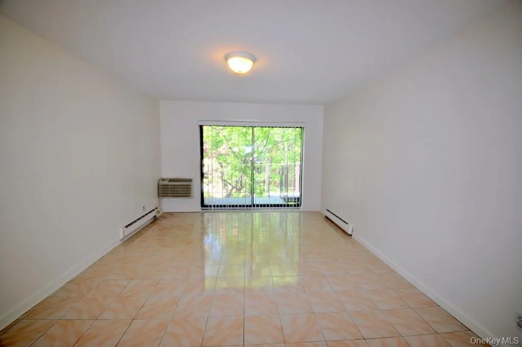 Living room has sliding glass doors to a private balcony. Living room has sliding glass doors to a private balcony.