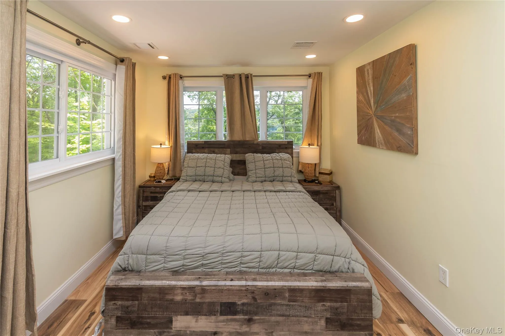 Bedroom with baseboards, wood finished floors, and recessed lighting Bedroom with baseboards, wood finished floors, and recessed lighting