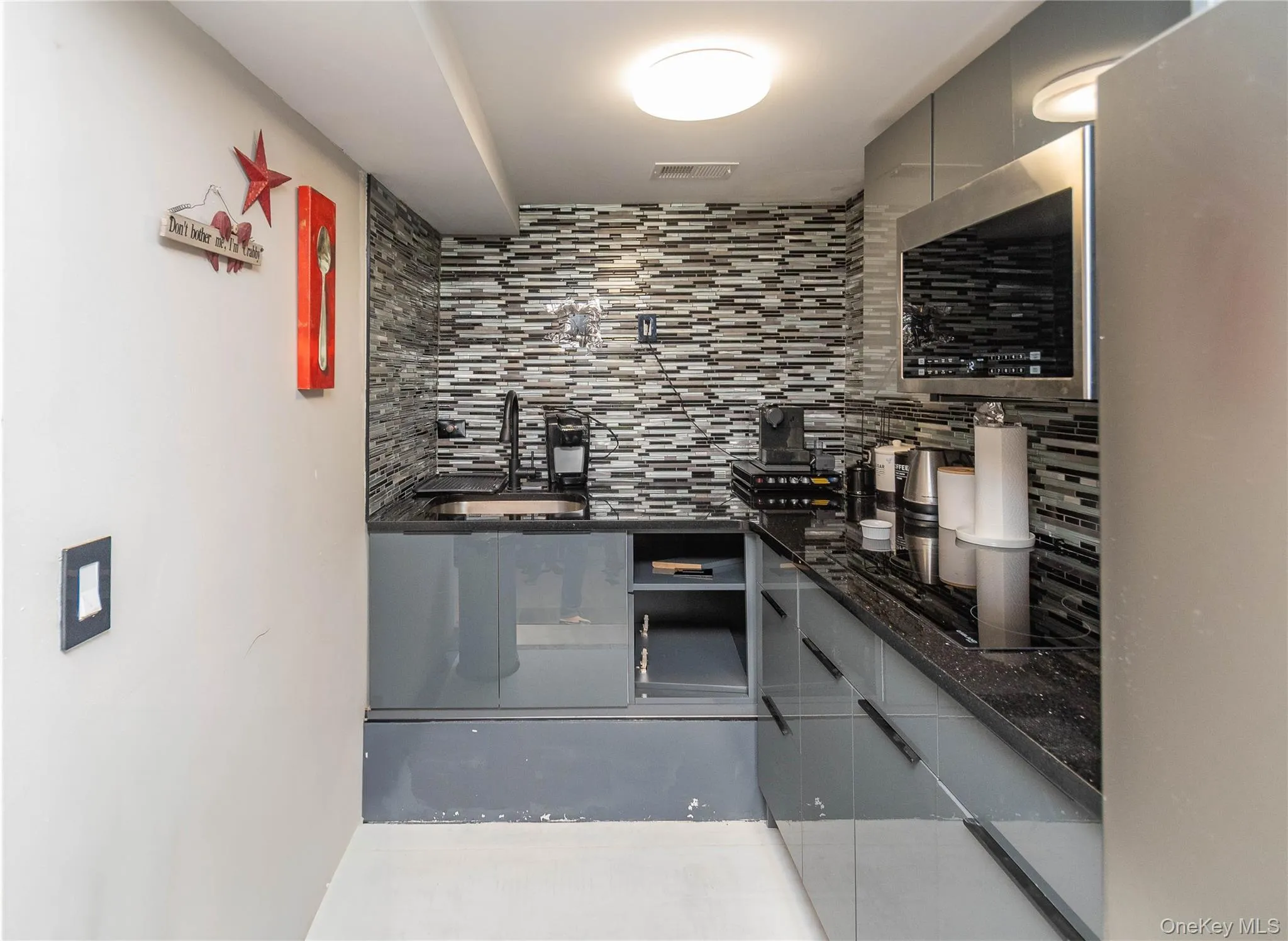 Indoor bar featuring decorative backsplash Indoor bar featuring decorative backsplash