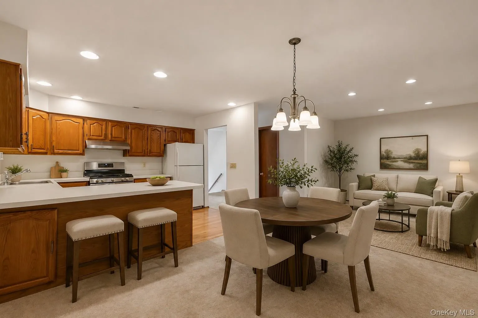 Virtually staged kitchen, dining area, den Virtually staged kitchen, dining area, den