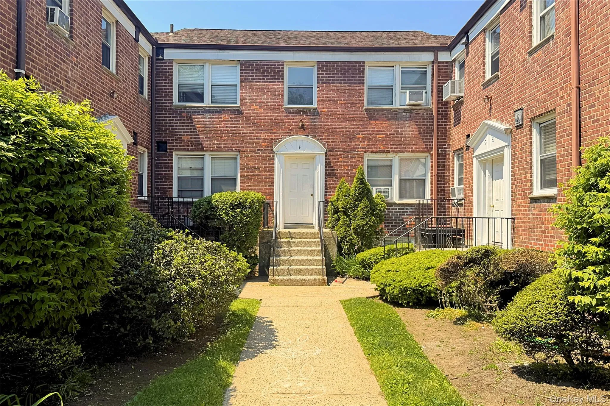 Brick exterior with multiple windows and white trim Brick exterior with multiple windows and white trim