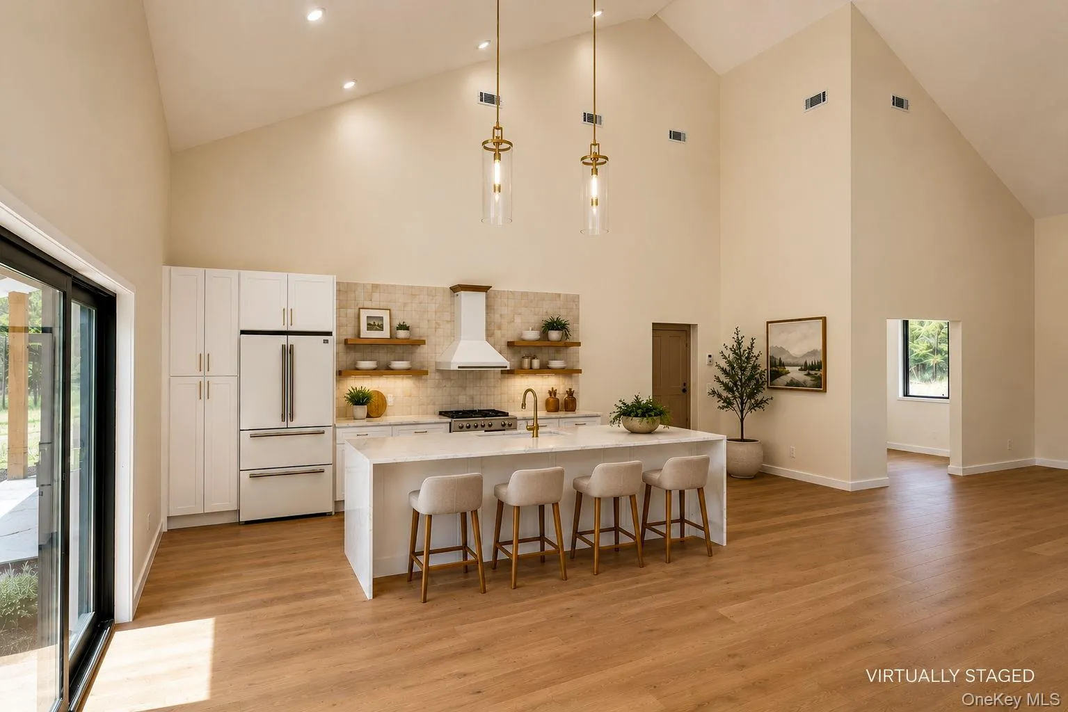 Open floor plan showing view from dining area to the kitchen with Kitchen Island and breakfast bar. Virtually staged. Furniture has been digitally added to show the room's potential scale and layout." Open floor plan showing view from dining area to the kitchen with Kitchen Island and breakfast bar. Virtually staged. Furniture has been digitally added to show the room's potential scale and layout."