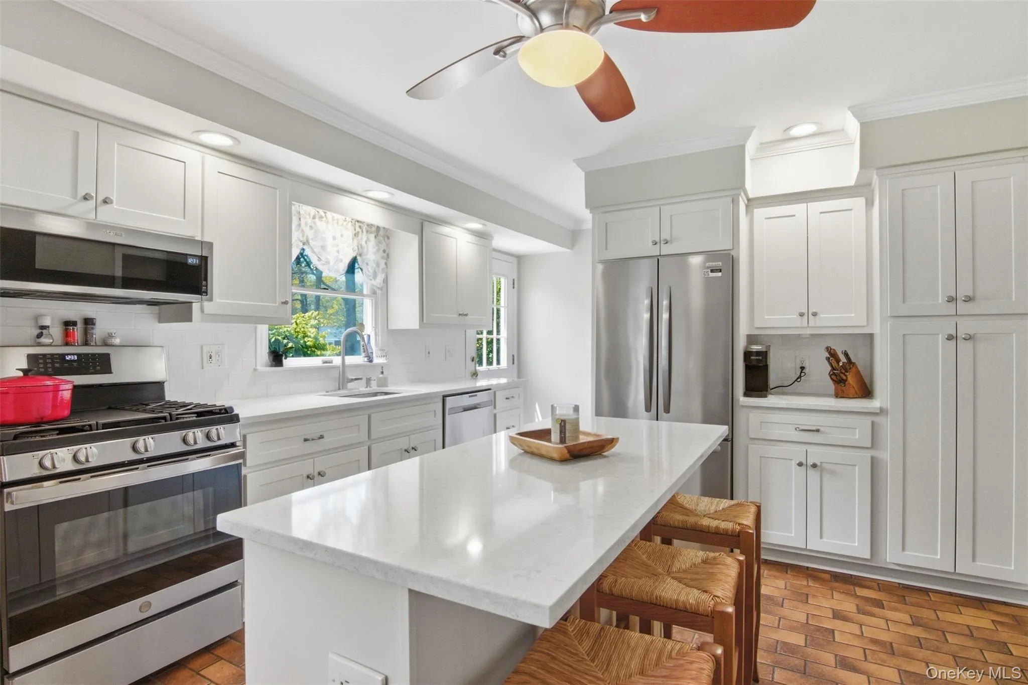 White Cabinetry, Quartz Countertops, Stainless Steel Appliances White Cabinetry, Quartz Countertops, Stainless Steel Appliances