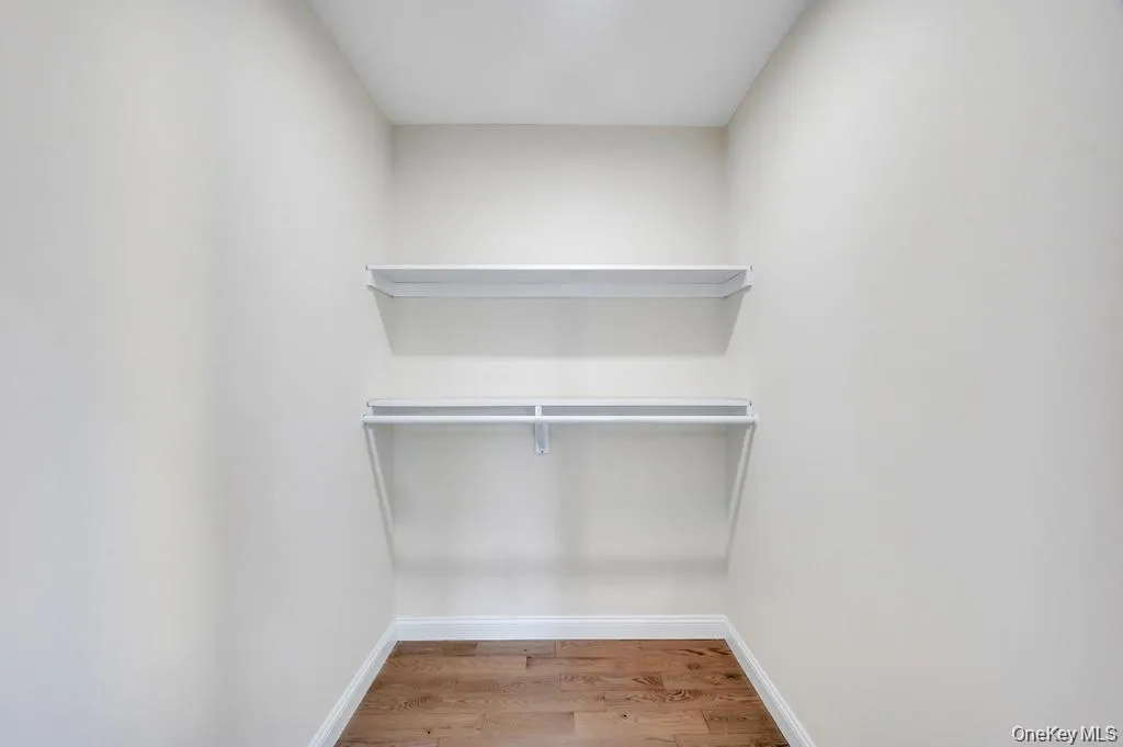 Primary Suite Walk-In Closet Primary Suite Walk-In Closet