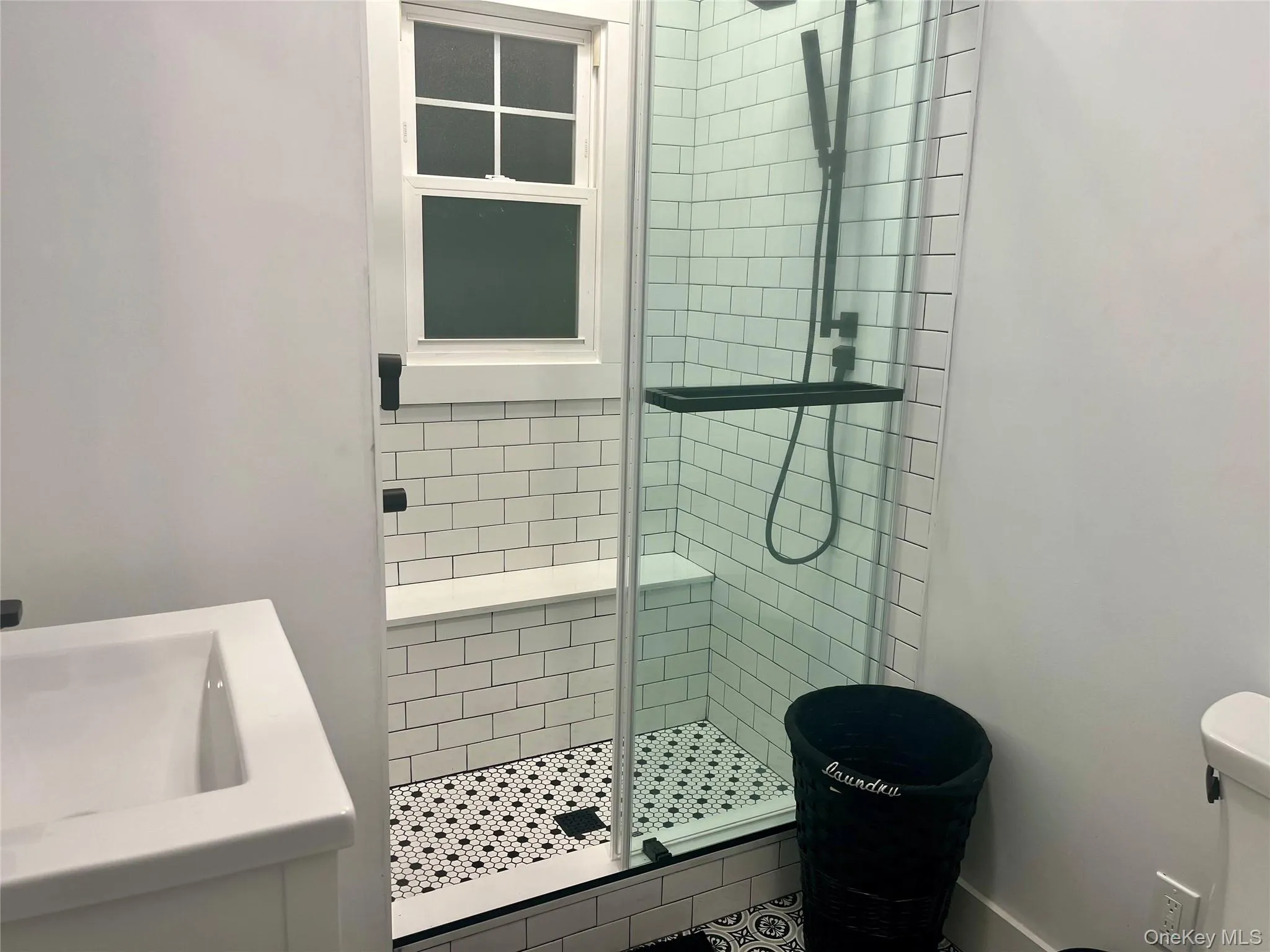 Bathroom with a stall shower and vanity Bathroom with a stall shower and vanity