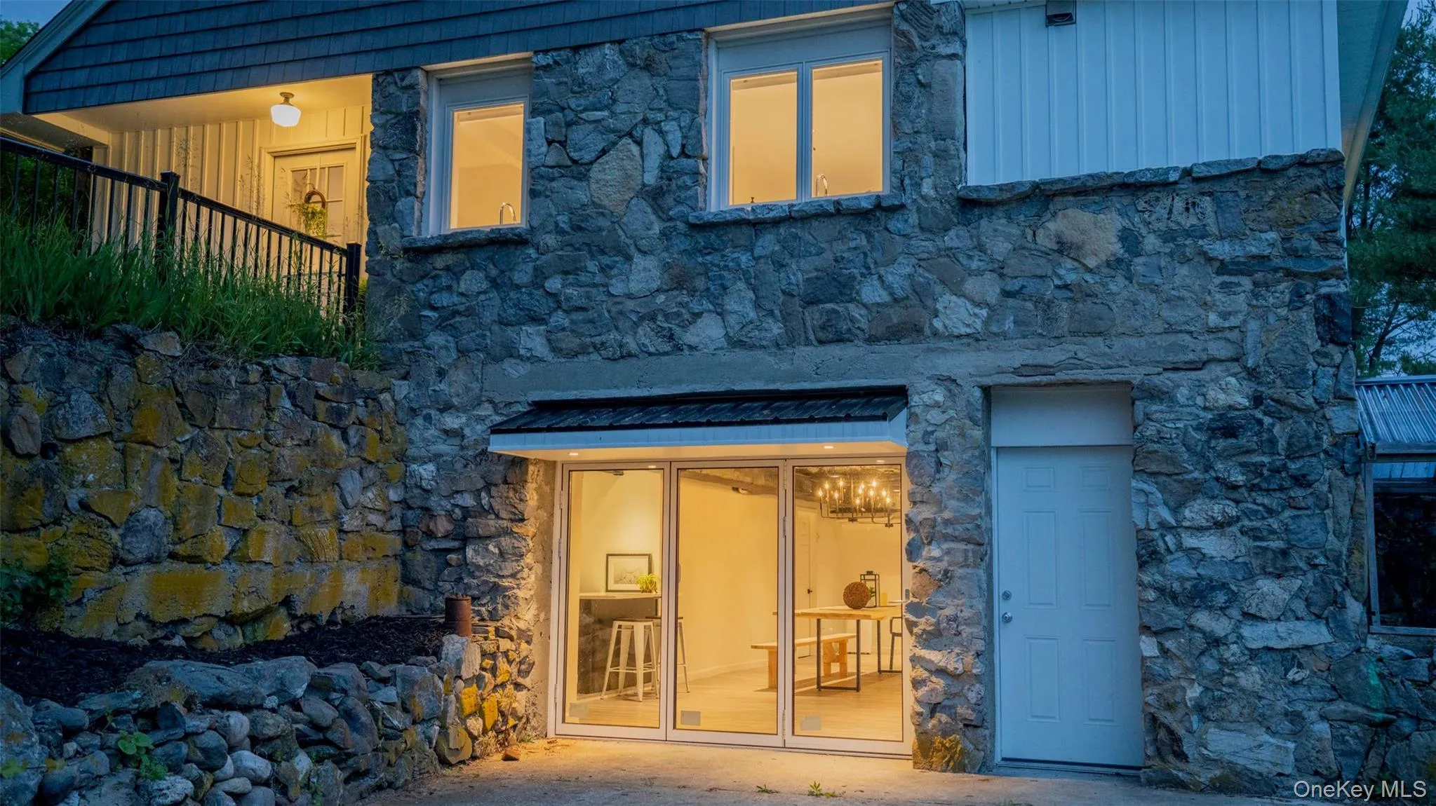 Entrance to property featuring stone siding Entrance to property featuring stone siding