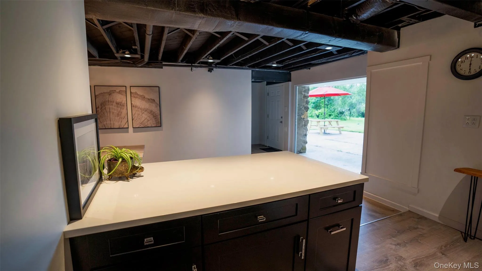 Kitchen with wood finished floors and light countertops Kitchen with wood finished floors and light countertops