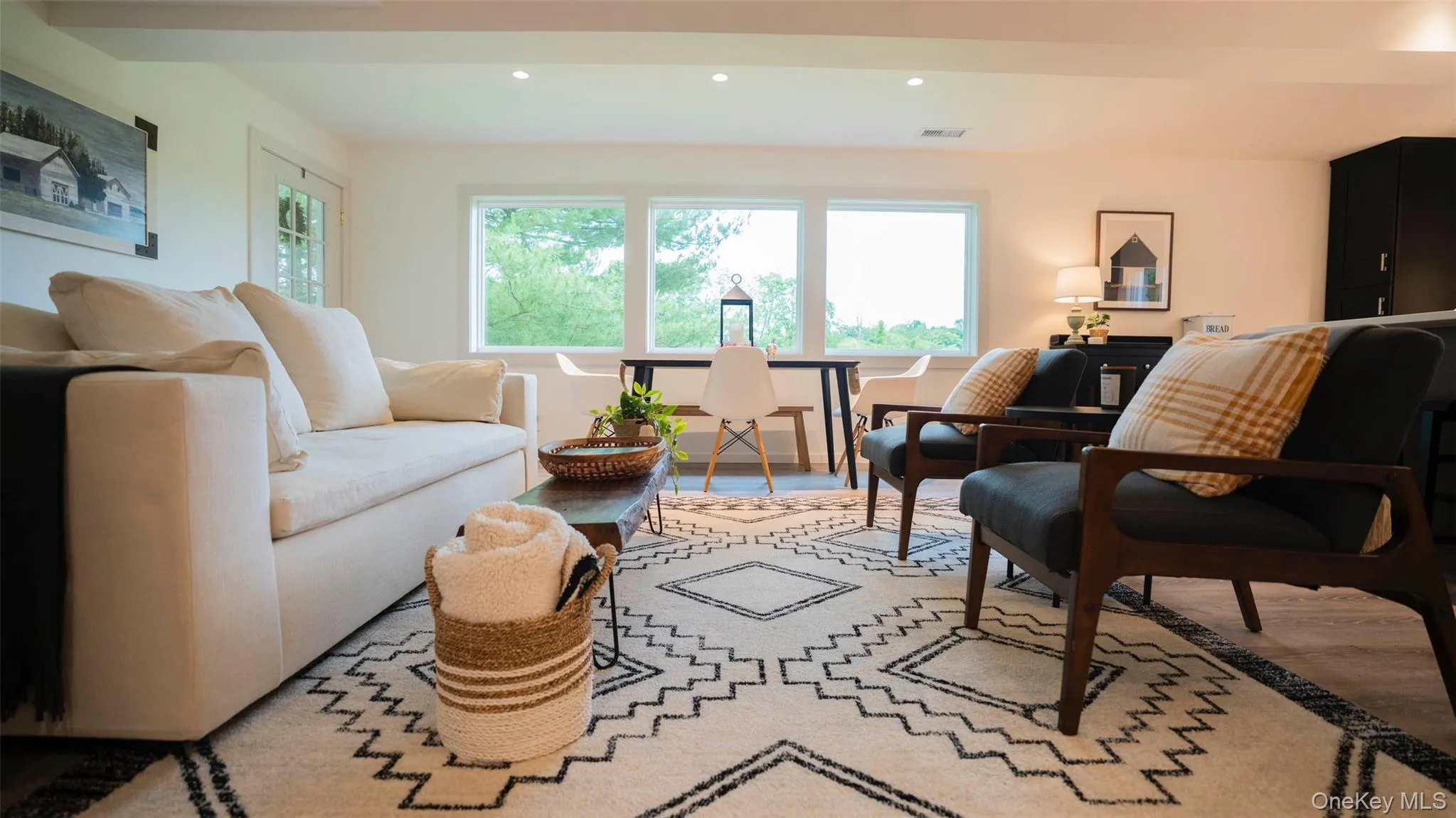 Living room with healthy amount of natural light, wood finished floors, and recessed lighting Living room with healthy amount of natural light, wood finished floors, and recessed lighting