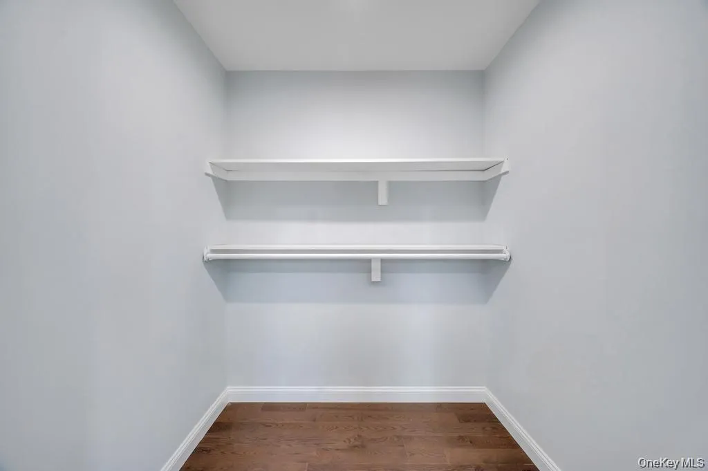 Primary Suite Walk-In Closet Primary Suite Walk-In Closet