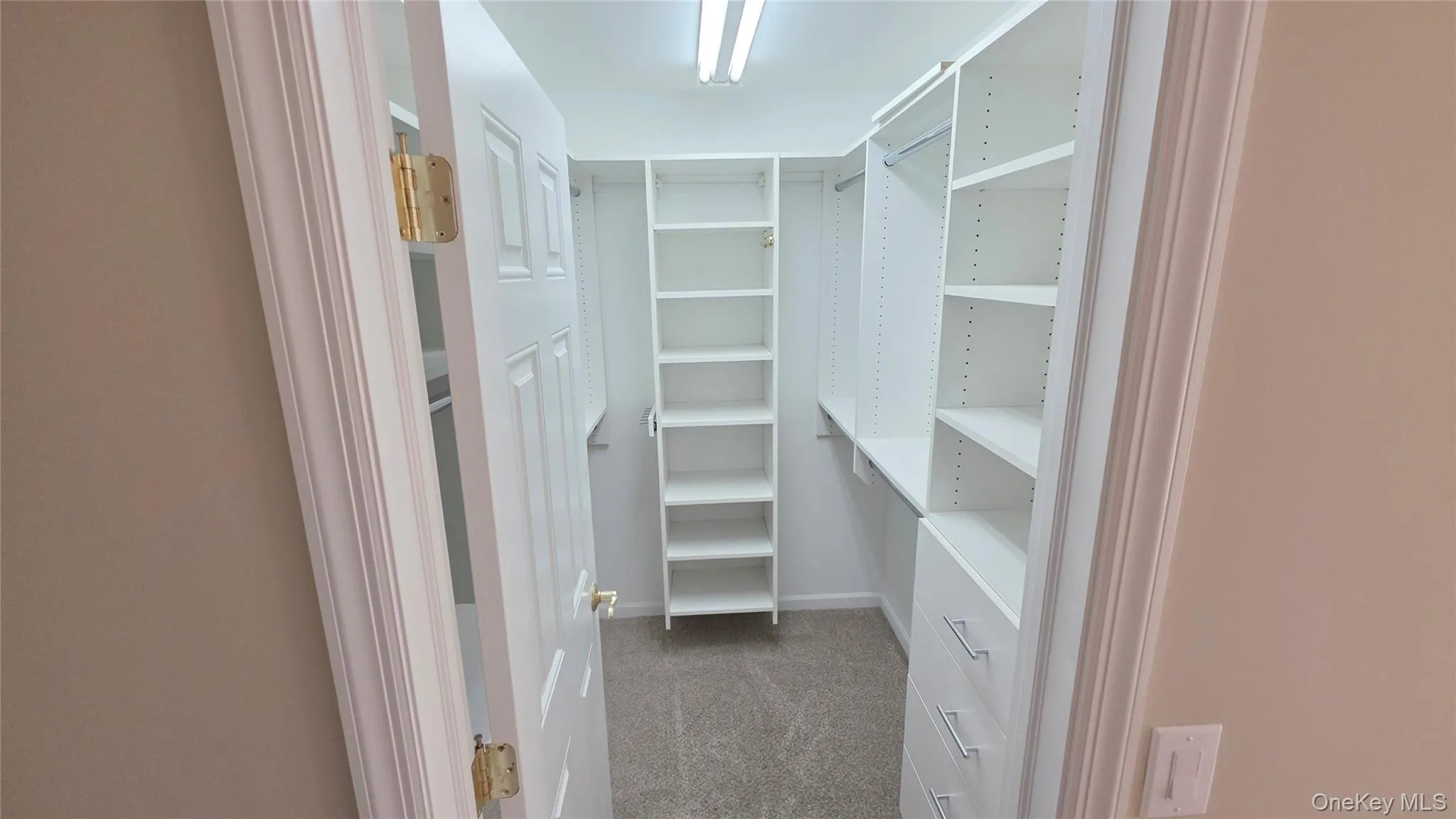 Primary bedroom Walk-In Closet with storage system Primary bedroom Walk-In Closet with storage system
