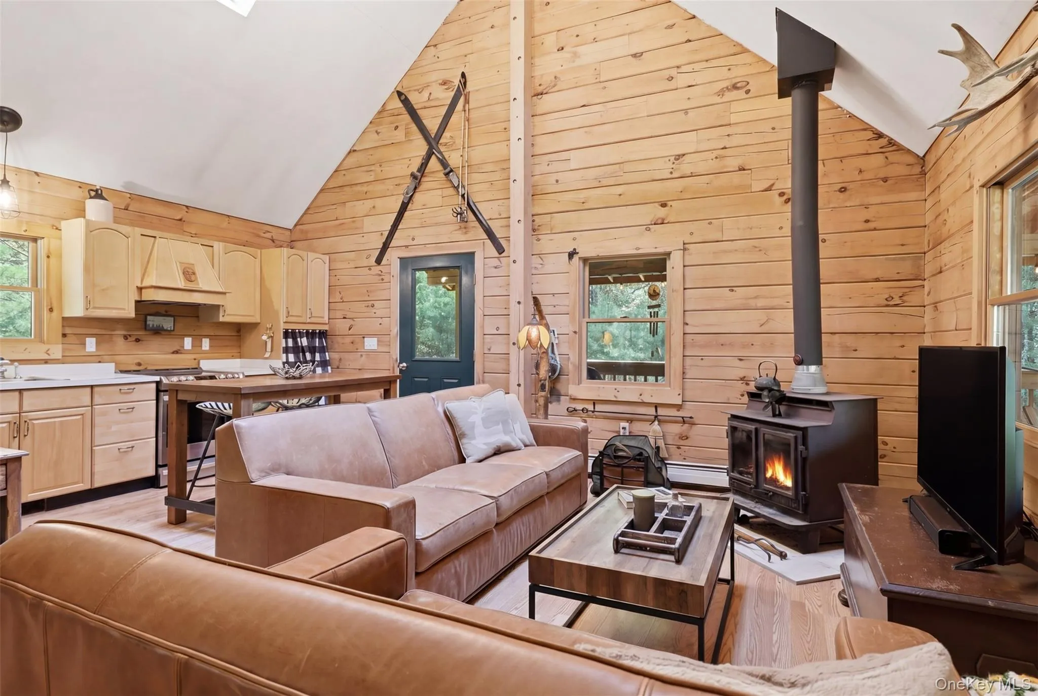 High ceilings, wood burning stove, lots of windows and an open concept layout. High ceilings, wood burning stove, lots of windows and an open concept layout.