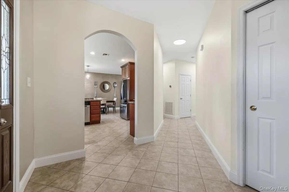 hallway from entry foyer to kitchen and Lr, ceramic tiles hallway from entry foyer to kitchen and Lr, ceramic tiles