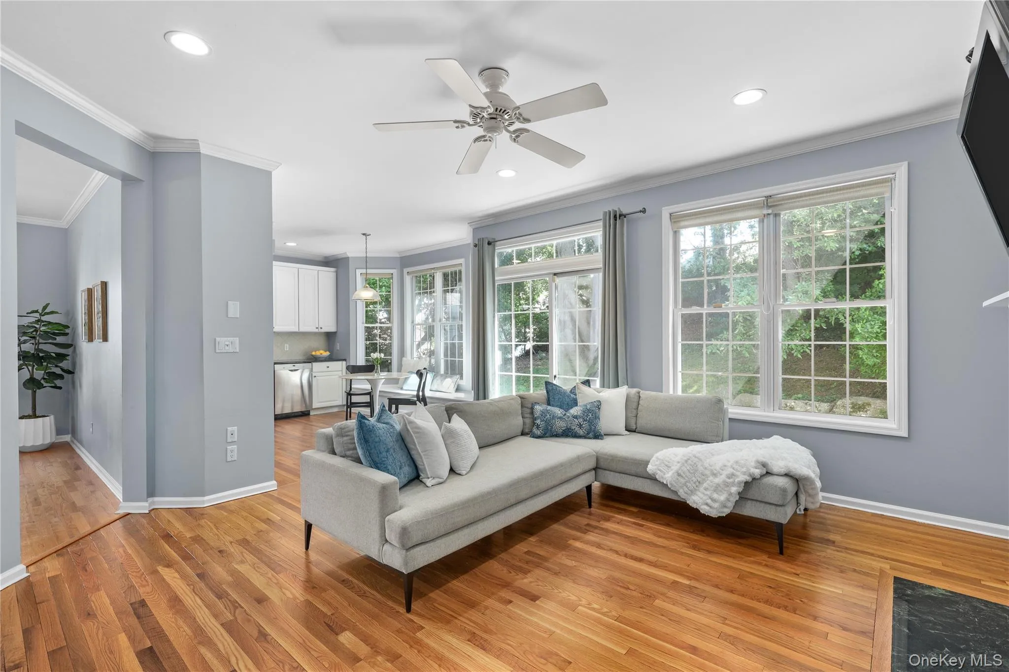 Family room with newly refinished flooring and sliding doors to patio Family room with newly refinished flooring and sliding doors to patio