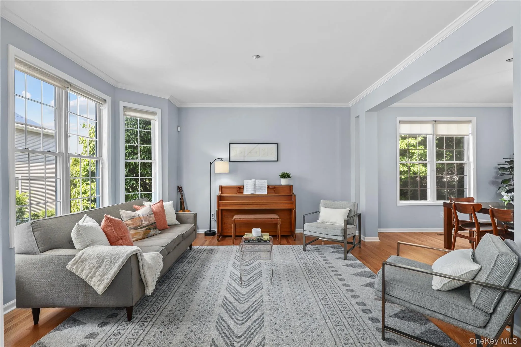 Sun-filled living room with bay window and nine-foot ceilings Sun-filled living room with bay window and nine-foot ceilings