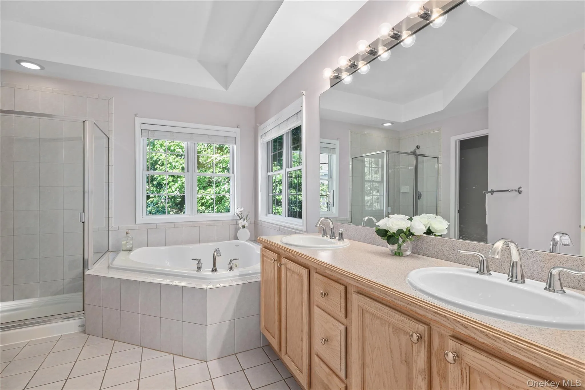 Primary bath with separate shower and spa tub Primary bath with separate shower and spa tub