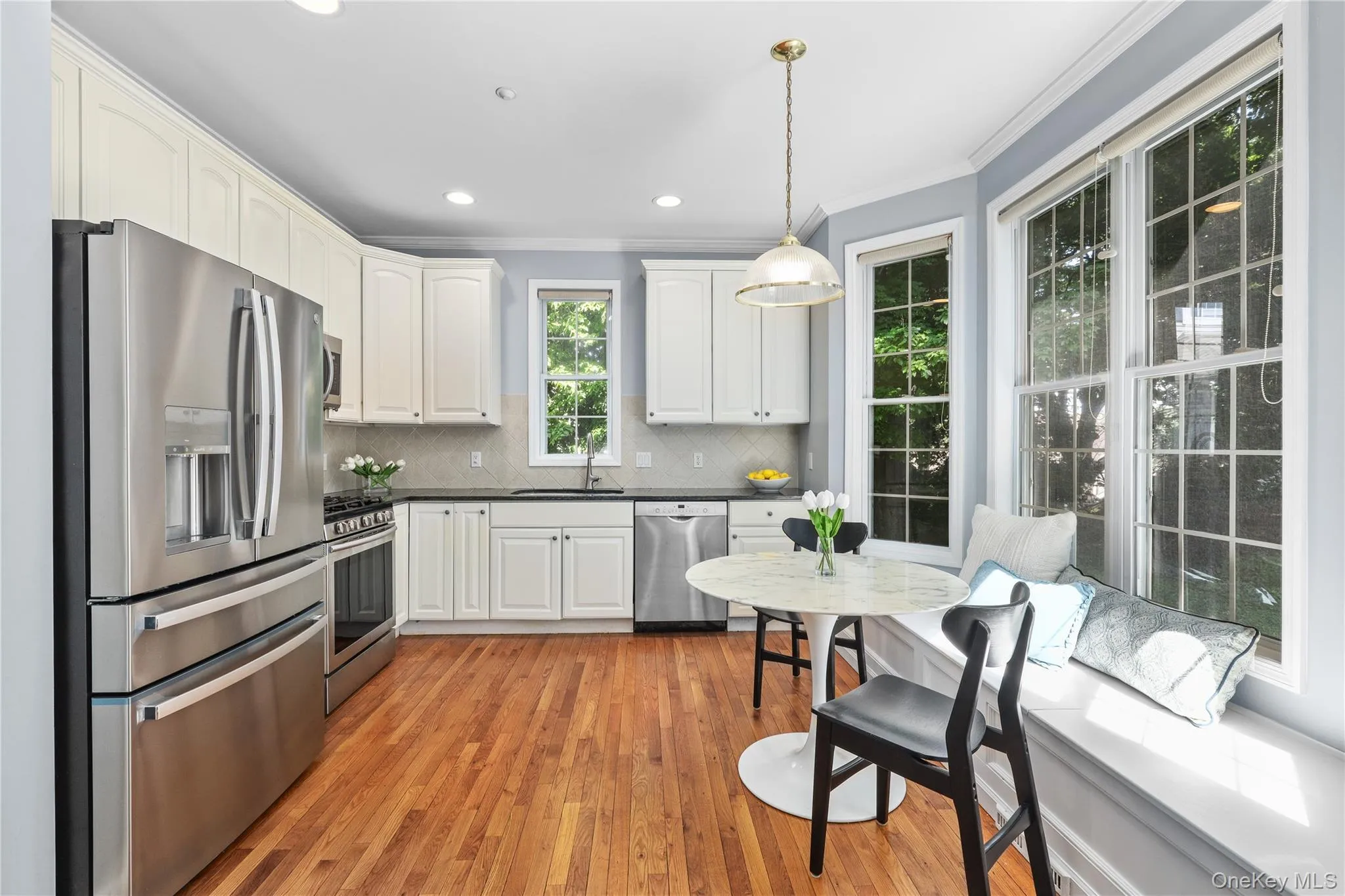 Eat-in kitchen with pantry, built-in banquet and bay windows to enjoy the backyard views Eat-in kitchen with pantry, built-in banquet and bay windows to enjoy the backyard views