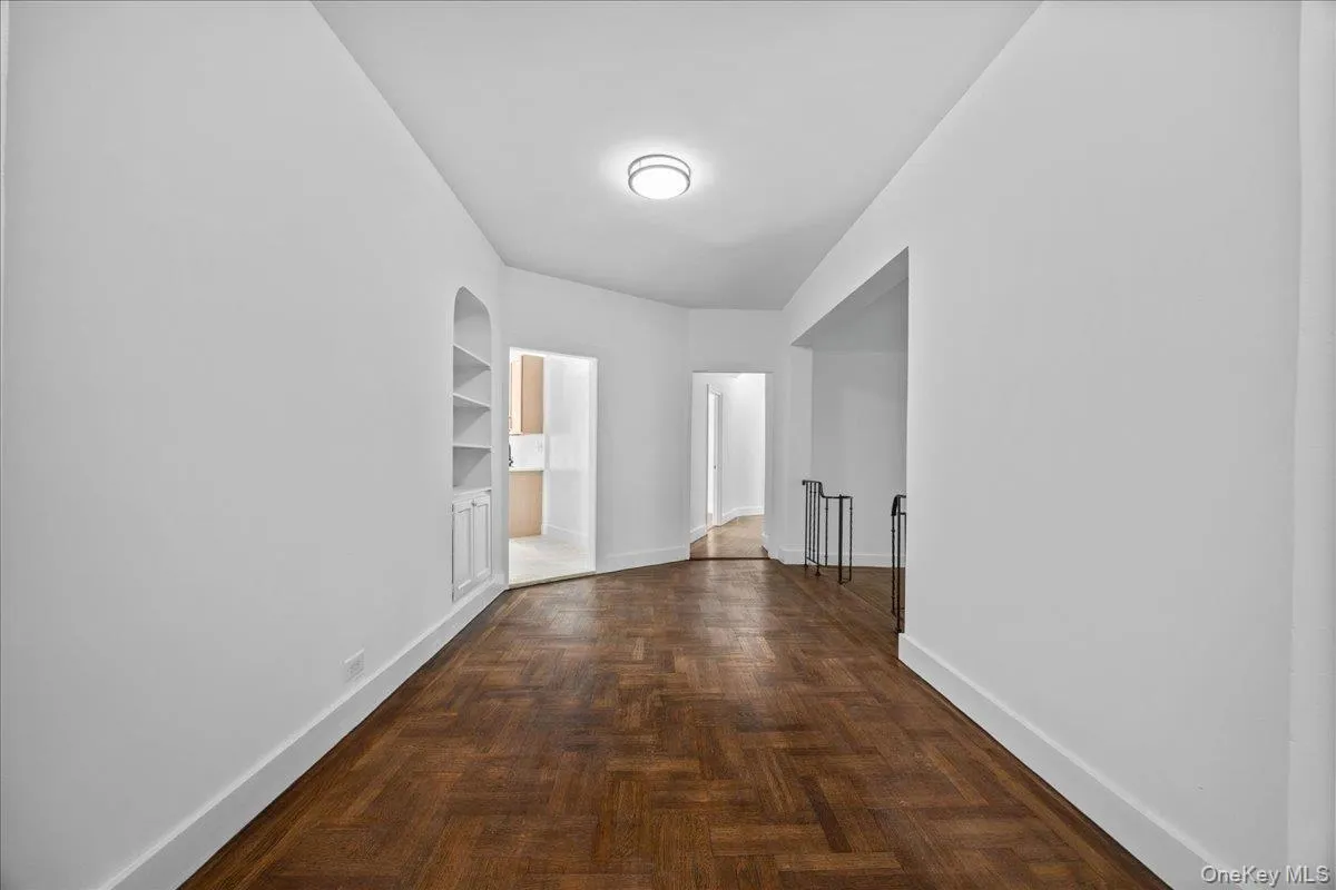 Wood-finish flooring extending through an expansive corridor Wood-finish flooring extending through an expansive corridor