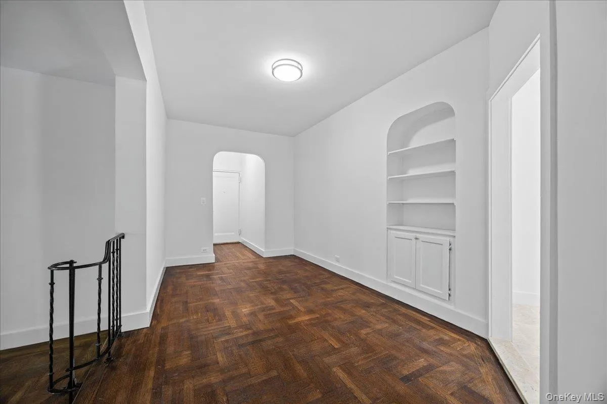 Wood-finish flooring extending through an expansive corridor Wood-finish flooring extending through an expansive corridor