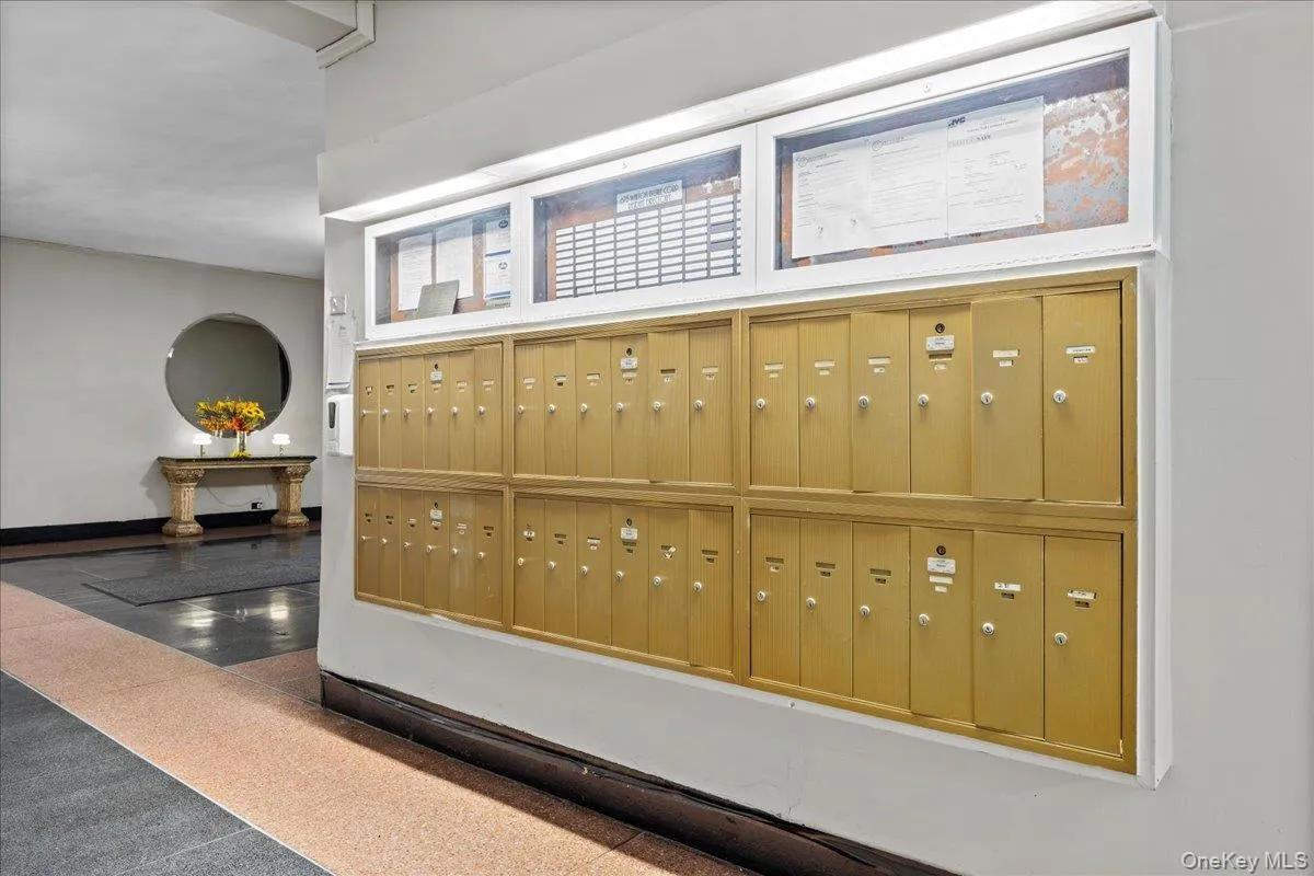 Building mailboxes featuring a gold-tone finish and integrated directory Building mailboxes featuring a gold-tone finish and integrated directory