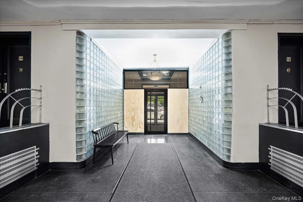Building entry hall with glass block walls and dark flooring Building entry hall with glass block walls and dark flooring