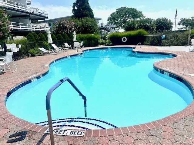 Community pool with a patio Community pool with a patio