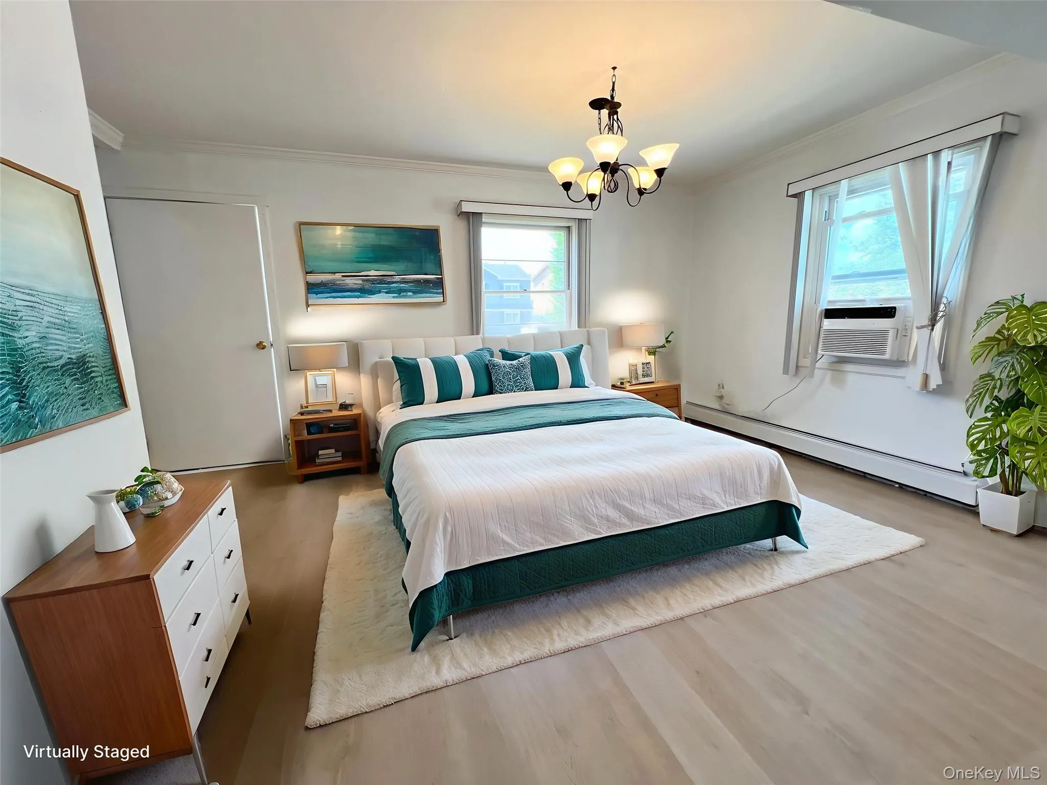 Bedroom with crown molding, wood finished floors, a baseboard radiator, and a chandelier Bedroom with crown molding, wood finished floors, a baseboard radiator, and a chandelier