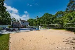 View of home's community featuring volleyball court and a pool View of home's community featuring volleyball court and a pool
