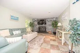 Living area featuring a large fireplace Living area featuring a large fireplace