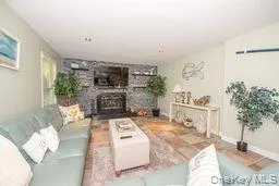 Living area featuring a large fireplace Living area featuring a large fireplace