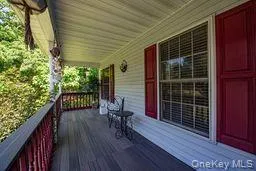 Deck featuring a porch Deck featuring a porch