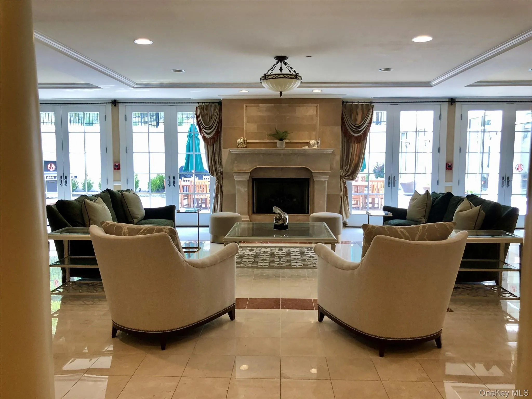 Newly furnished living room lobby with fireplace. Newly furnished living room lobby with fireplace.