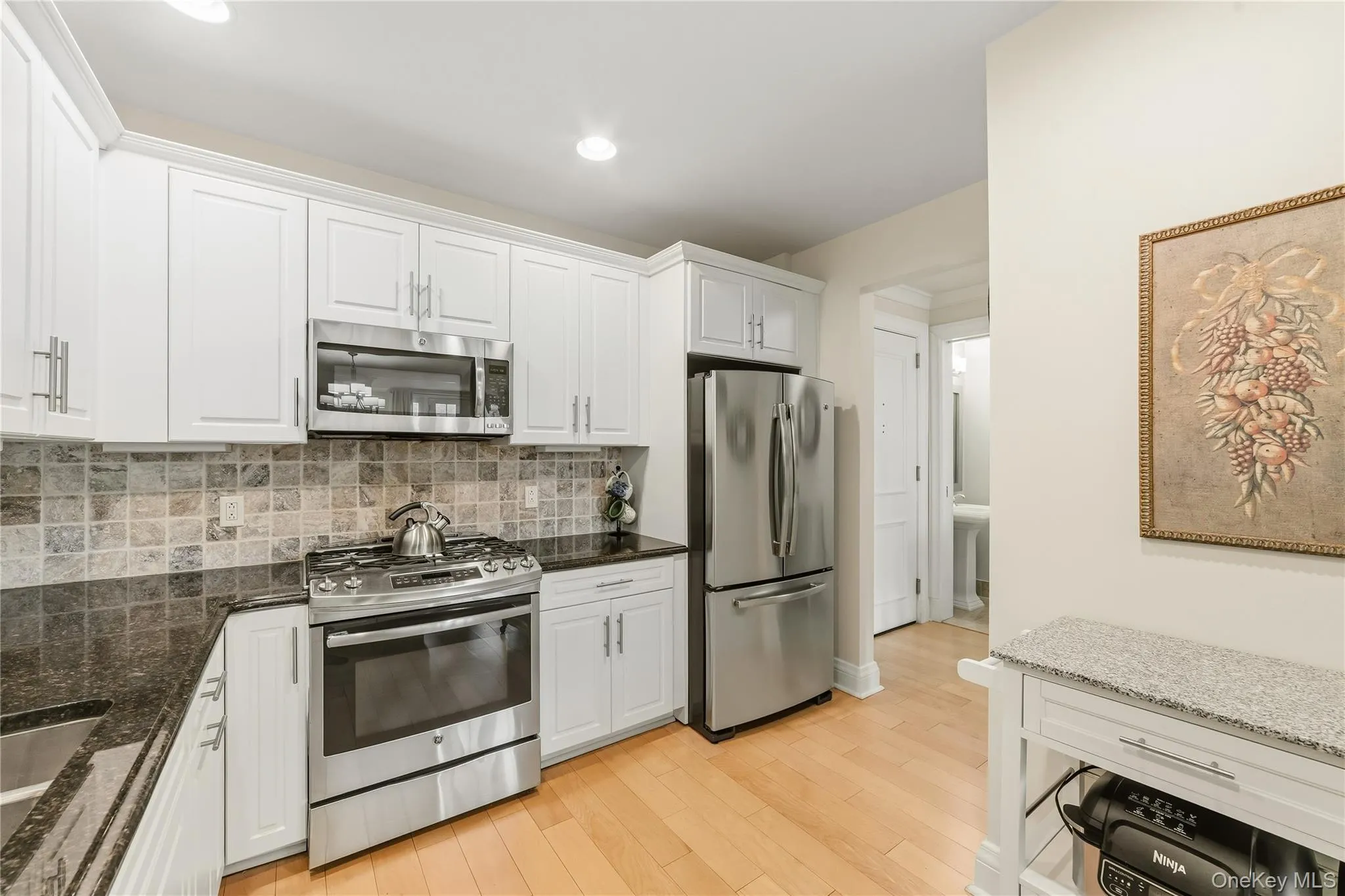All Like New stainless appliances, Granite counters, designer white cabinets. All Like New stainless appliances, Granite counters, designer white cabinets.