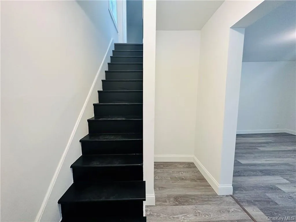 Staircase with hardwood / wood-style floors Staircase with hardwood / wood-style floors