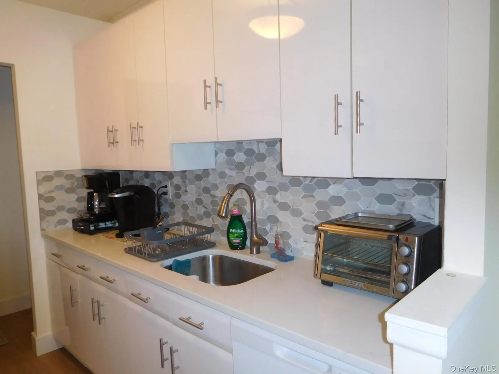 Opposite view of Updated Kitchen w/Glass Tile Backsplash Opposite view of Updated Kitchen w/Glass Tile Backsplash