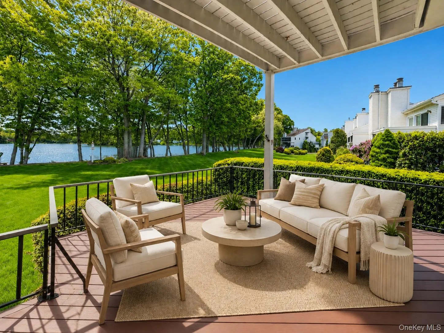 Virtually Staged. Enjoy stunning lake views on the large deck off the Living room Virtually Staged. Enjoy stunning lake views on the large deck off the Living room