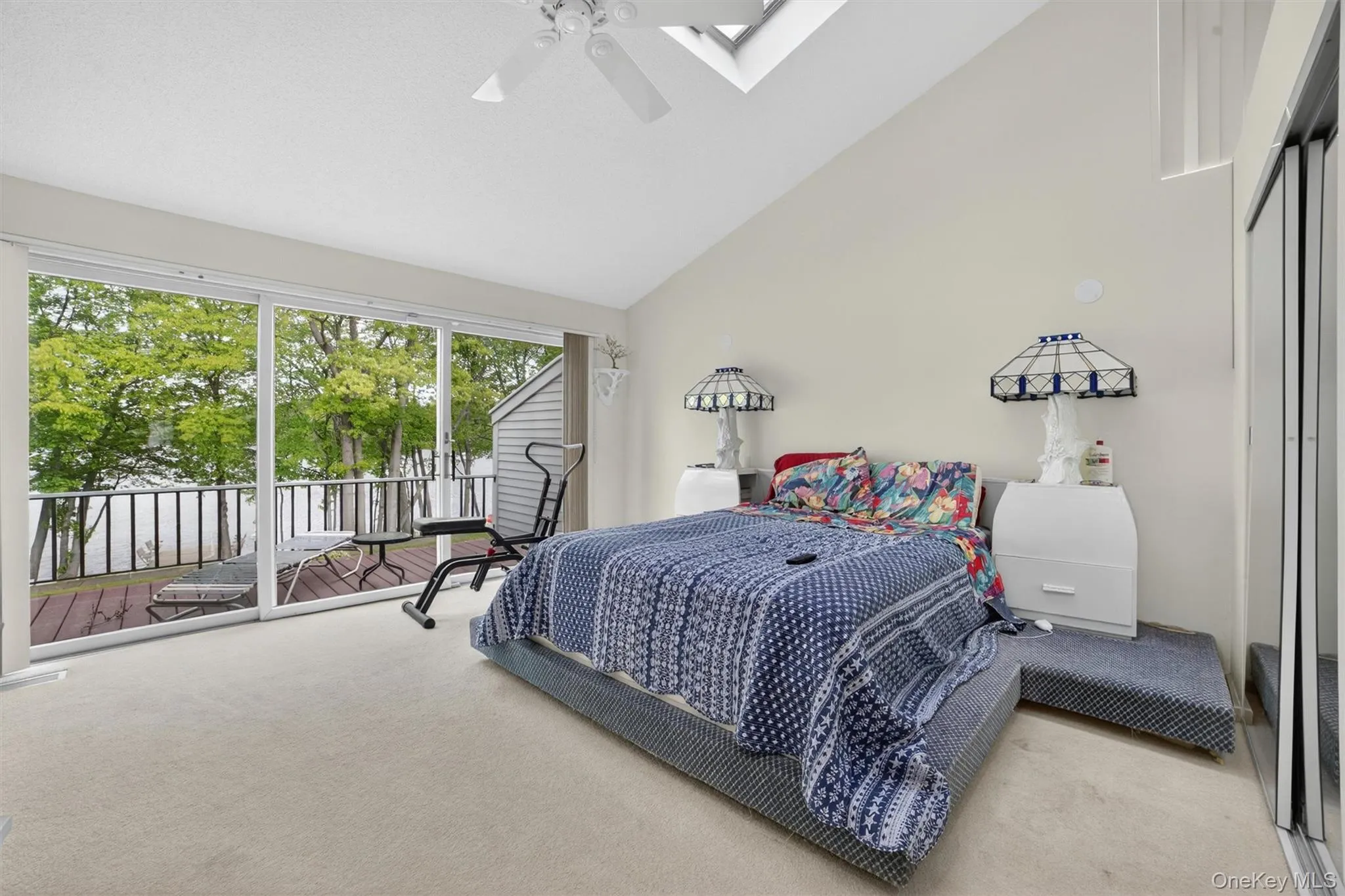 Oversized Primary bedroom with deck and beautiful lake views Oversized Primary bedroom with deck and beautiful lake views
