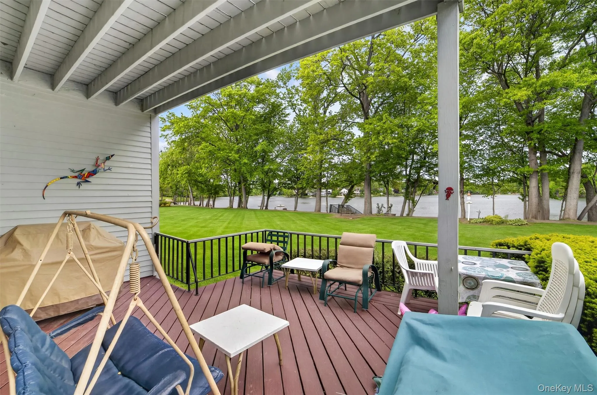 Enjoy stunning lake views on the large deck off the Living room Enjoy stunning lake views on the large deck off the Living room