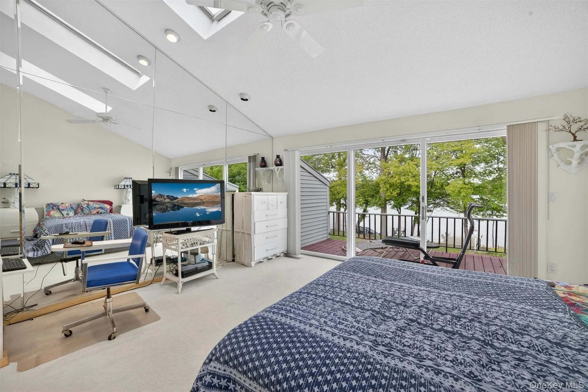 Oversized Primary bedroom with deck and beautiful lake views Oversized Primary bedroom with deck and beautiful lake views