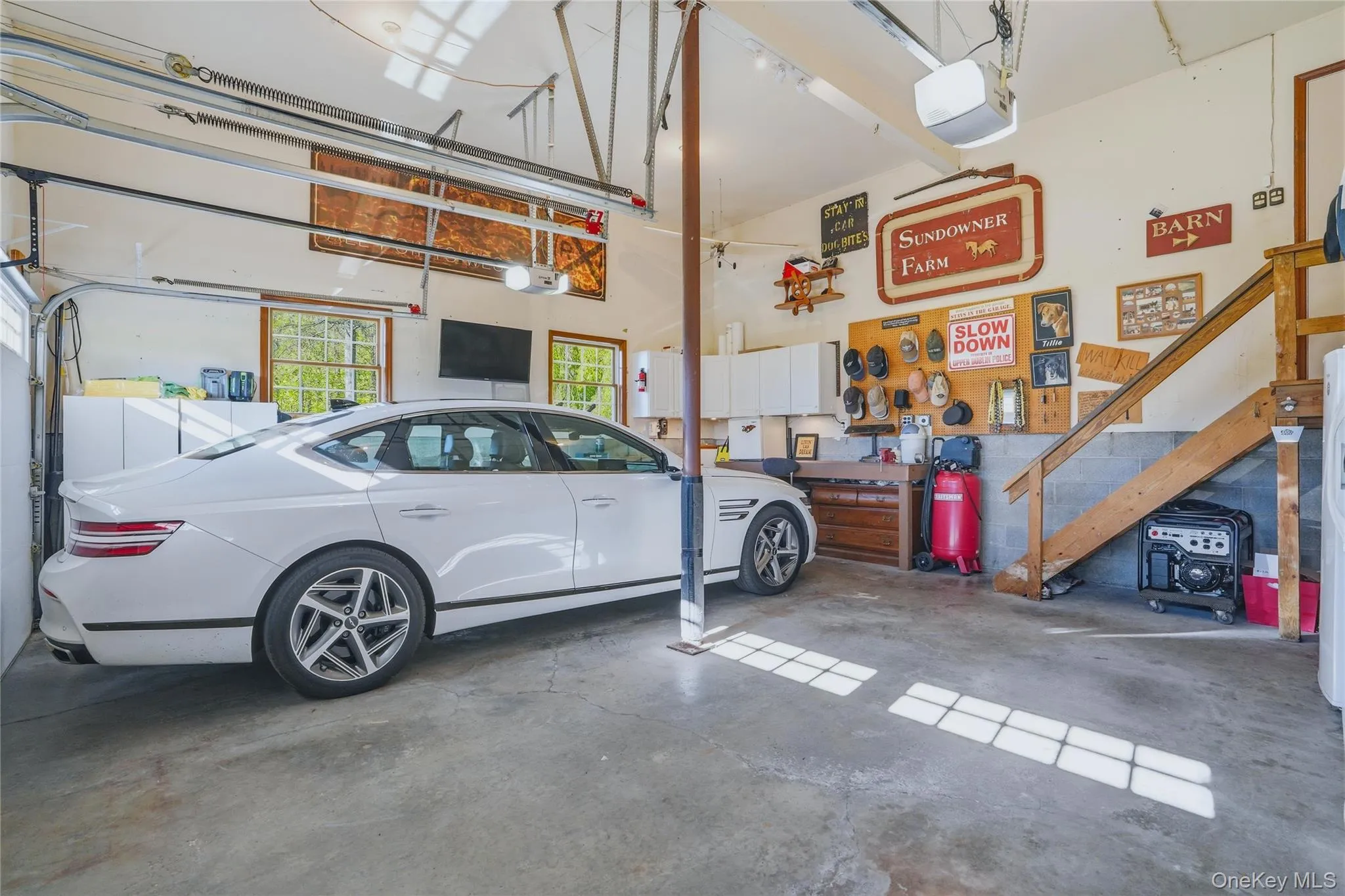Two-car garage with automatic door openers. High ceilings! Two-car garage with automatic door openers. High ceilings!